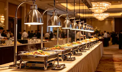 ceiling‑mount buffet heat lamps working in hotel banquet buffet line.webp